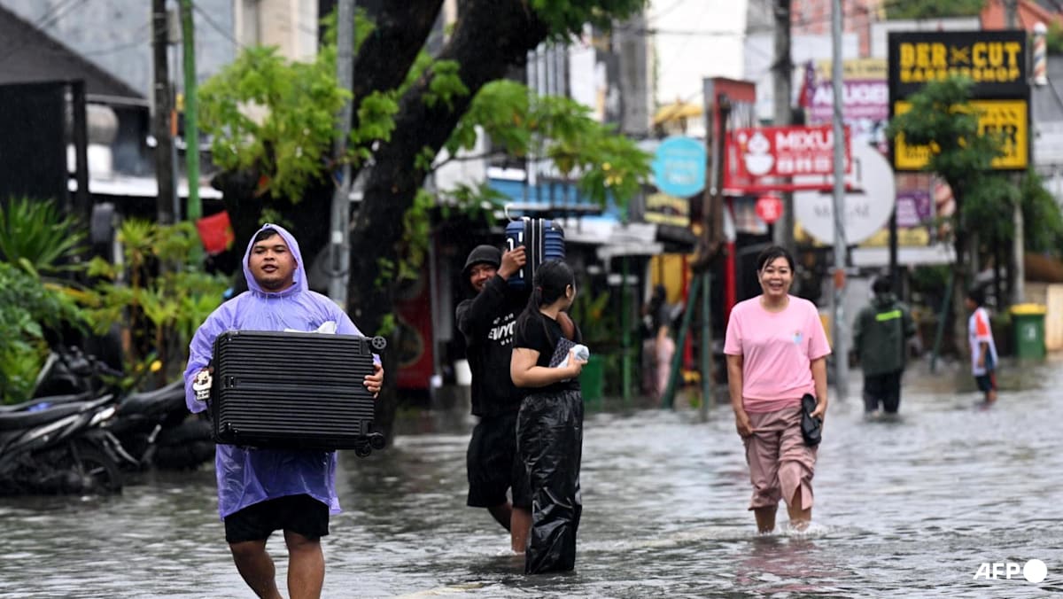 Bali flooding prompts tourist evacuation and airport disruptions