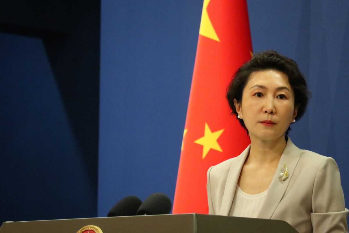 China trims growth target, aware of challenges ahead