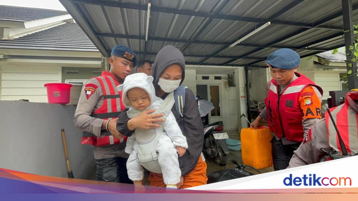 One-metre flood in Ciledug as Brimob evacuates children and babies