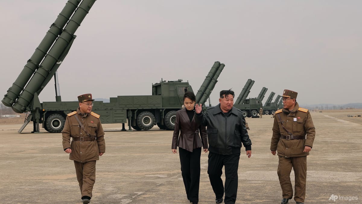 North Korean leader Kim observes test of rocket launch systems with daughter