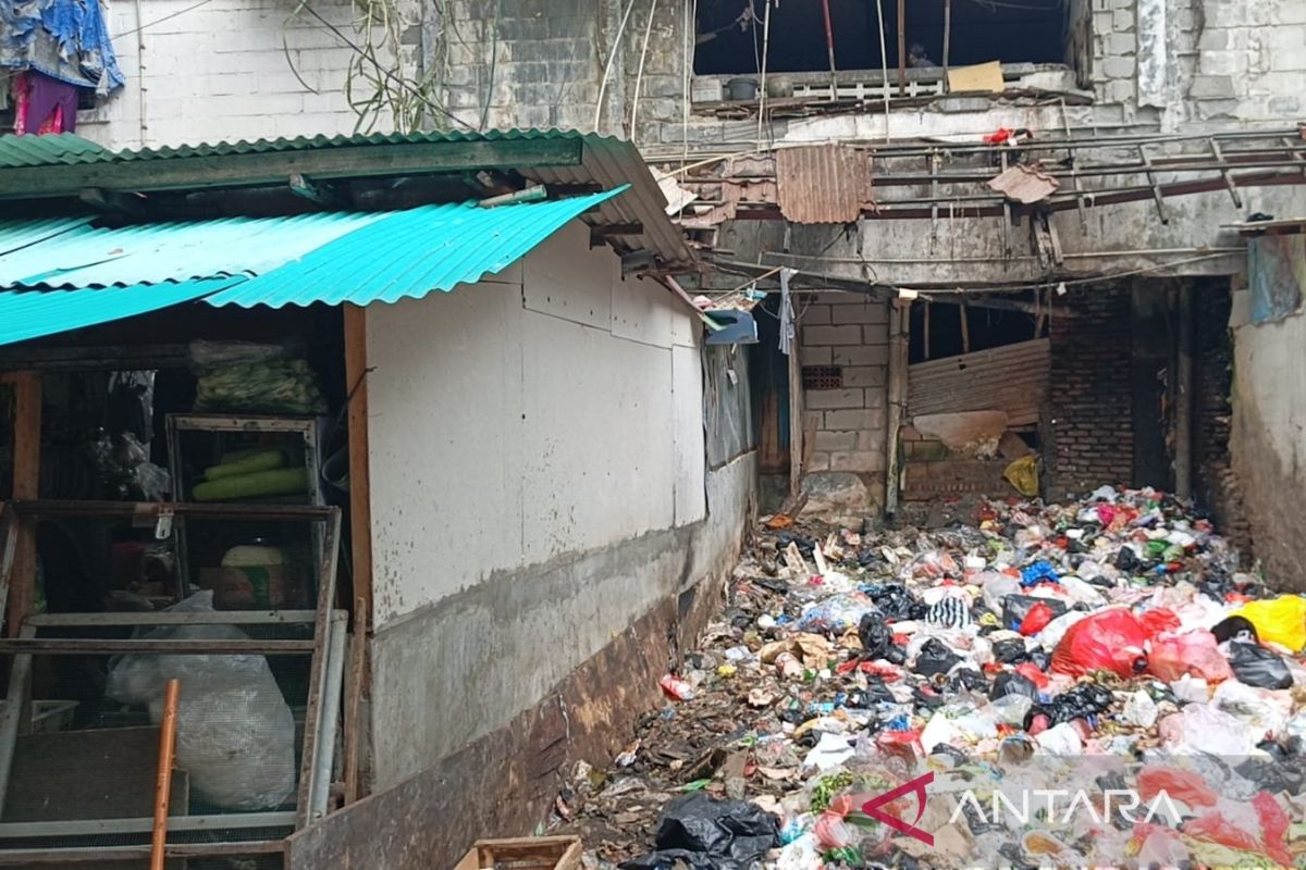 Rubbish pile at Angke Flats reportedly once collapsed shop wall