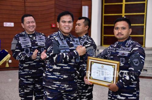 Navy Chief Awards Marine Task Forces for Capturing 56 OPM Bases