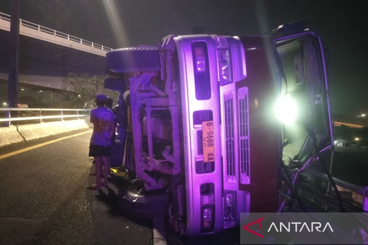 Overloaded trailer truck overturns on Tomang Elevated Toll Road