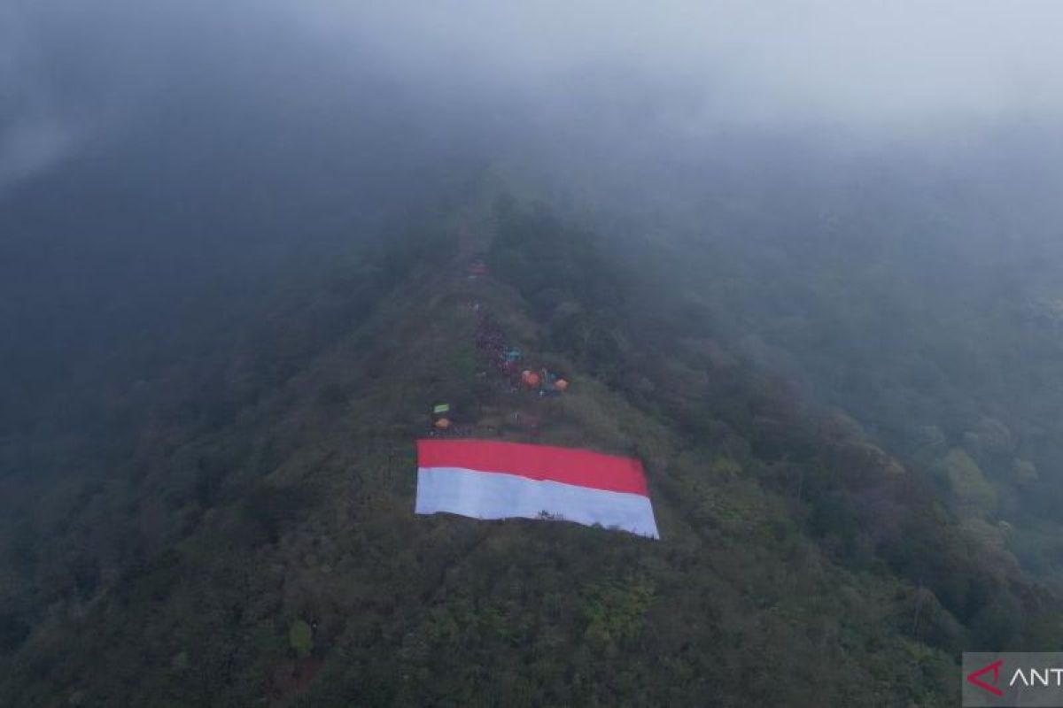 Giant Red-White Flag raised at Mount Sangar peak
