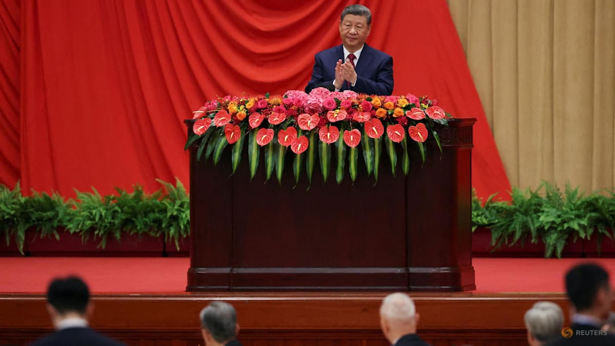Marking China's national day, Xi calls for progress towards reunification with Taiwan